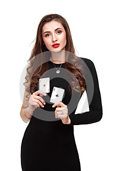 curly hair brunette posing with two aces cards in her hands, poker concept isolation on white background