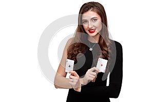 curly hair brunette posing with two aces cards in her hands, poker concept isolation on white background