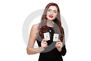 curly hair brunette posing with two aces cards in her hands, poker concept isolation on white background