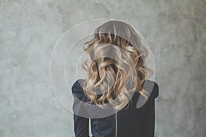 Curly hair. Perfect woman back and head with curly hairdo