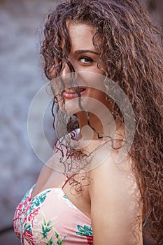 Curly hair woman portrait outdoor