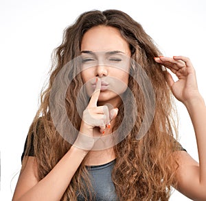 Curly hair woman showing quite tss sign on a white