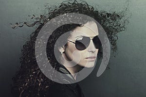 Curly hair woman with sunglasses