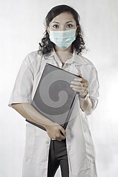 Curly-haired Asian woman docter.