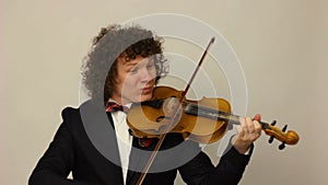 Curly-haired guy playing the violin