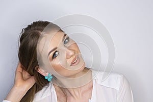 Curly long hair blonde young model. Beauty girl with curly perfect hairstyle Limited depth of field