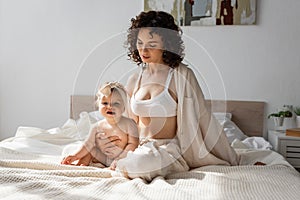 curly mother in loungewear with crop