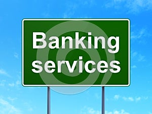 Currency concept: Banking Services on road sign background