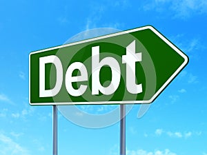 Currency concept: Debt on road sign background