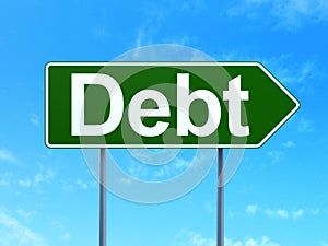 Currency concept: Debt on road sign background