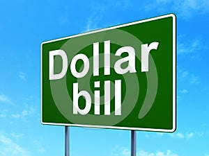 Currency concept: Dollar Bill on road sign background