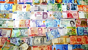 Currency of different countries background. Colorful banknotes of different countries as background close up
