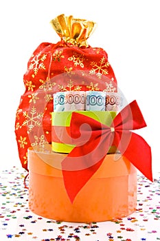 Currency gift and red bag on a white background