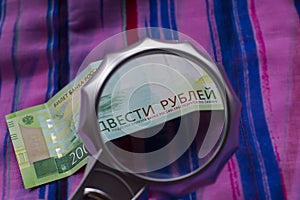 Currency new rubles, banknotes nominal 200. Macro image. Banknote of two hundred Russian rubles, detail