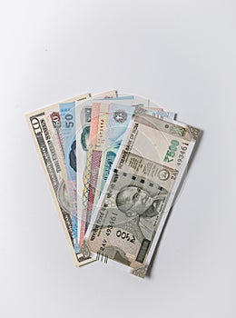 Currency notes of many countries inserted in the Indian legal passport booklet.