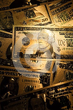 Currency US golden dollar banknotes close-up background.