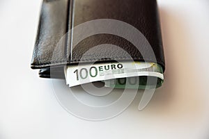 Currency in the wallet and on the table
