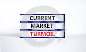 Current market turmoil symbol. Concept words Current market turmoil on books on a beautiful white table white background. Business