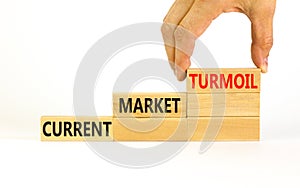 Current market turmoil symbol. Concept words Current market turmoil on wooden blocks on a beautiful white table white background.