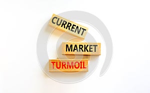 Current market turmoil symbol. Concept words Current market turmoil on wooden blocks on a beautiful white table white background.