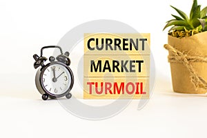 Current market turmoil symbol. Concept words Current market turmoil on wooden blocks on a beautiful white table white background.