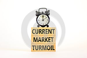 Current market turmoil symbol. Concept words Current market turmoil on wooden blocks on a beautiful white table white background.