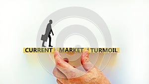 Current market turmoil symbol. Concept words Current market turmoil on wooden blocks on a beautiful white table white background.