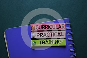 Curricular Practical Training text on sticky notes. Office desk background photo