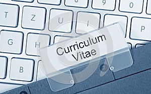 Curriculum Vitae - folder with text on computer keyboard