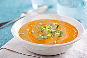 Curried carrot soup with cream and herbs