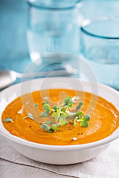Curried carrot soup with cream and herbs