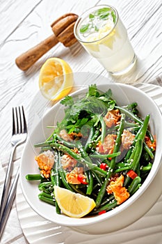 Curried salmon with green beans and lemon water