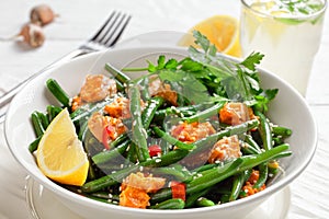 Curried salmon with green beans and lemon water