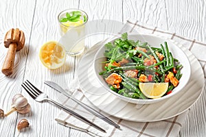Curried salmon with green beans and lemon water