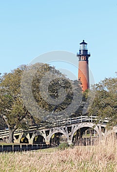 The Currituck Beach Lighthouse and wooden bridge near Corolla, North Carolina vertical