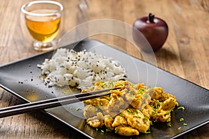 Curry chicken and oriental rice in a dish