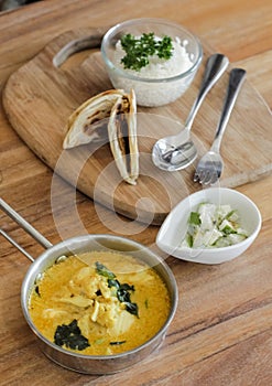 Curry Dish with Paratha serve on wooden tray