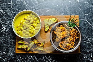 Curry gnocchi with bhajjis and roasted potato photo