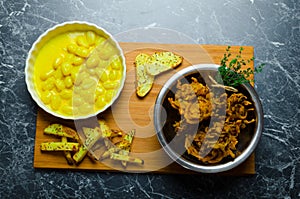 Curry gnocchi with bhajjis and roasted potato photo