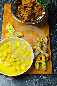 Curry gnocchi with bhajjis and roasted potato photo