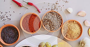 Curry, herbs and spices on table in kitchen for cooking, food or seasoning collection with color. Top View, powder and