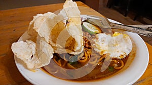 Curry Noodles from Indonesia, named Mie Aceh with Fried Egg