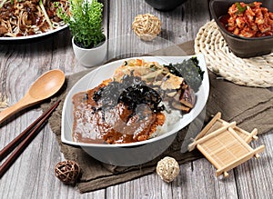 Curry Pork Chop Rice served dish isolated on table top view of asian food