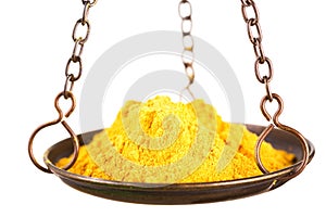 Curry powder in a balance scale