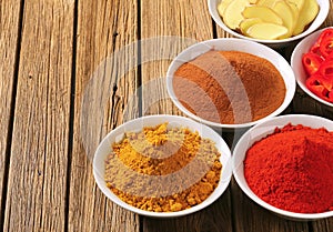 Curry powder, paprika, ground cinnamon, sliced ginger root and