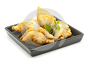 Curry Puffs in a black plate