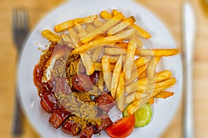 Curry sausage with French fries