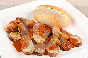 A curry sausage with roll