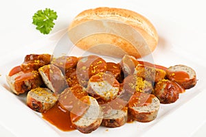 A curry sausage with roll