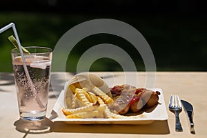 Currywurst and pommes on recyclable dishes